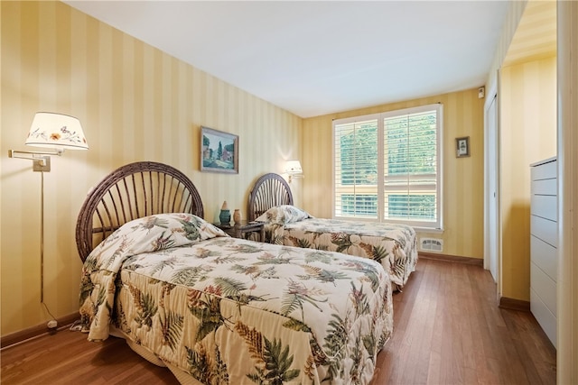 bedroom featuring wood-type flooring