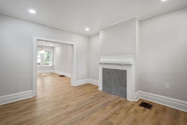 unfurnished living room with wood-type flooring