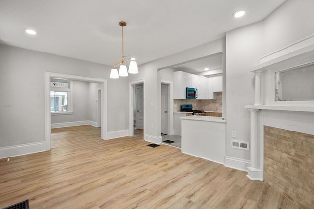 unfurnished living room with light hardwood / wood-style floors