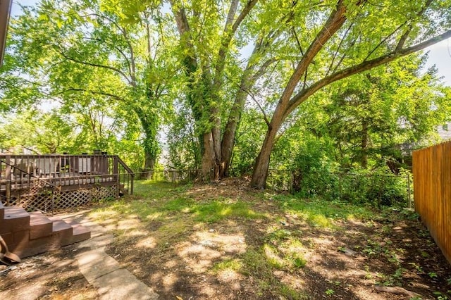 view of yard featuring a wooden deck