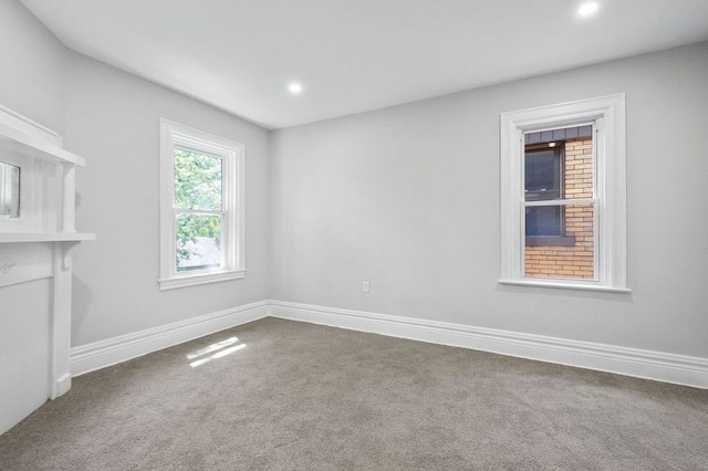 unfurnished living room featuring carpet floors