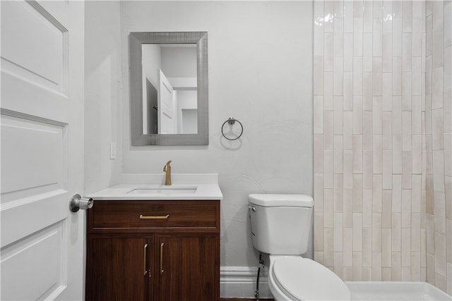 bathroom with toilet and vanity