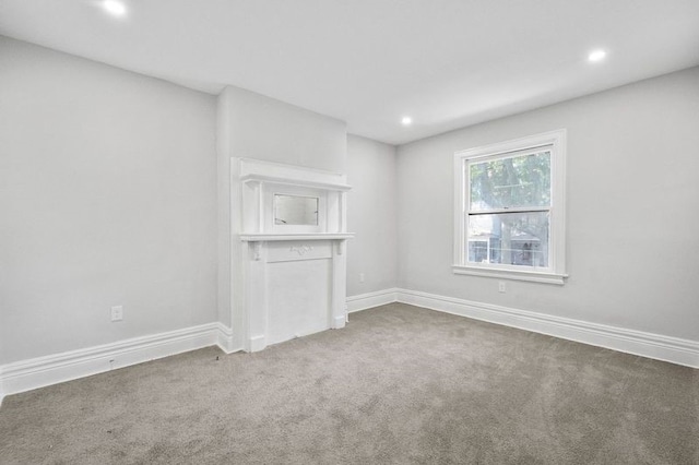 unfurnished living room with carpet flooring