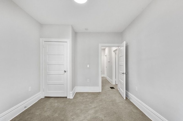 unfurnished bedroom featuring carpet flooring