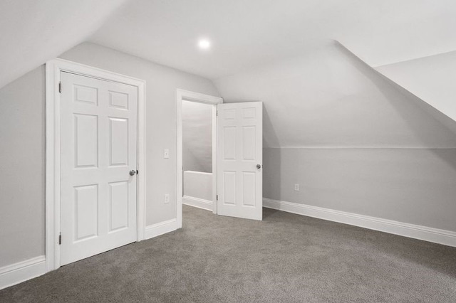 bonus room with carpet flooring and lofted ceiling