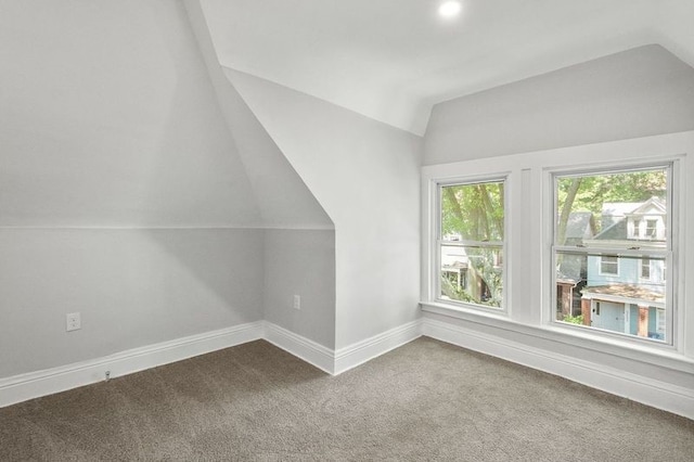 bonus room featuring lofted ceiling and carpet floors