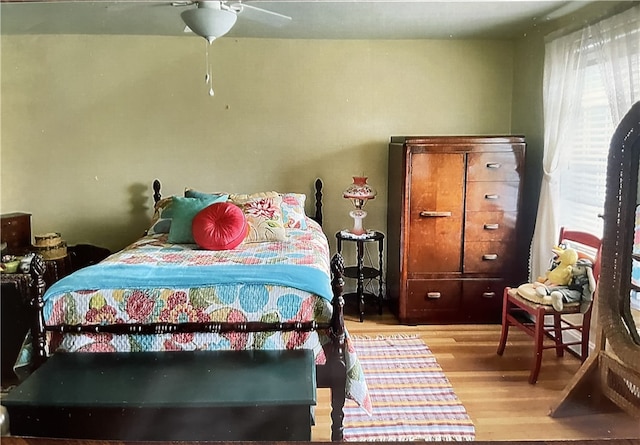 bedroom featuring ceiling fan and light hardwood / wood-style floors