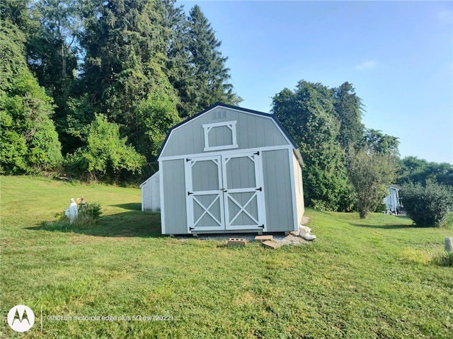 view of outdoor structure with a lawn