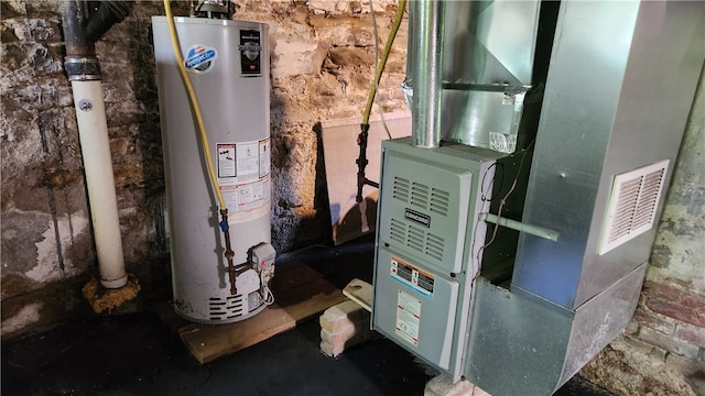 utility room with water heater and heating unit