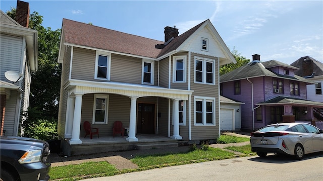 view of front facade with a garage and covered porch