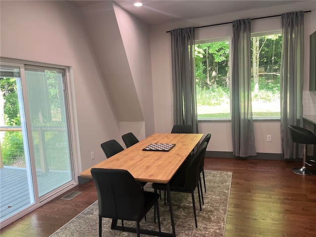 dining area with dark wood-style floors, recessed lighting, and visible vents