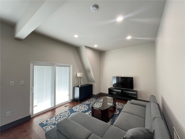 living room with beam ceiling, recessed lighting, wood-type flooring, visible vents, and baseboards