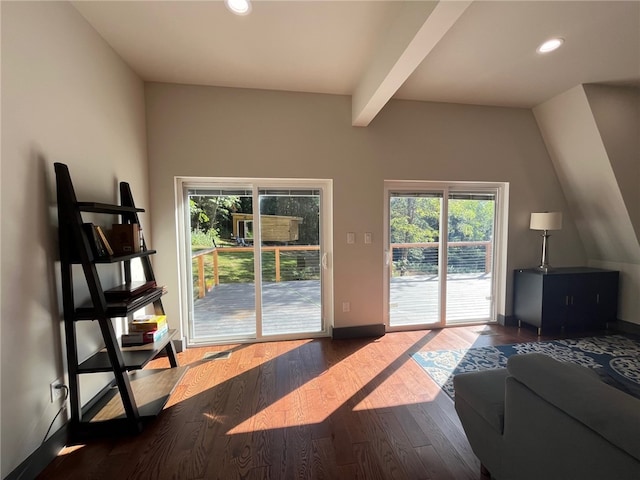 doorway with recessed lighting, baseboards, wood finished floors, and beamed ceiling