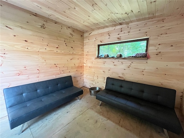 unfurnished room with wood ceiling and wooden walls