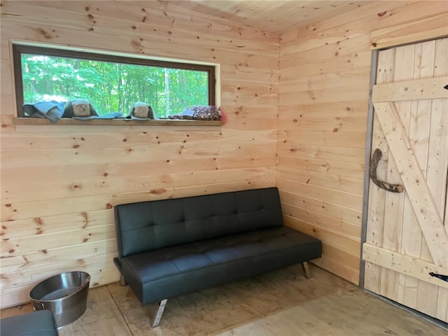 unfurnished room with wooden walls and a sauna