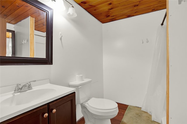 bathroom featuring vanity, wood-type flooring, toilet, and wood ceiling