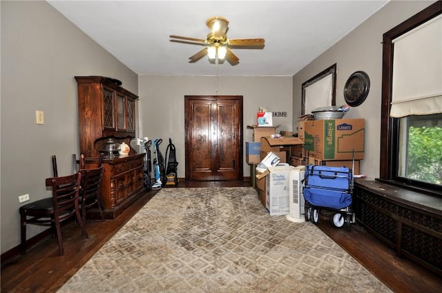 interior space featuring dark hardwood / wood-style flooring and ceiling fan