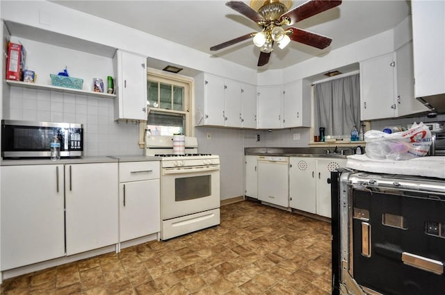 kitchen featuring tasteful backsplash, white appliances, and white cabinets