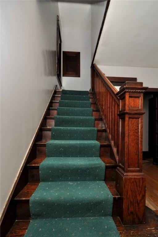 staircase featuring hardwood / wood-style floors