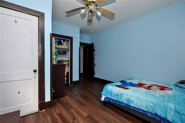 bedroom with dark wood-type flooring and ceiling fan