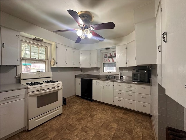 306 Shirls Ave, City Of Washington, PA 15301 - kitchen with white gas range, dishwasher, stainless steel countertops, white cabinetry, and ceiling fan