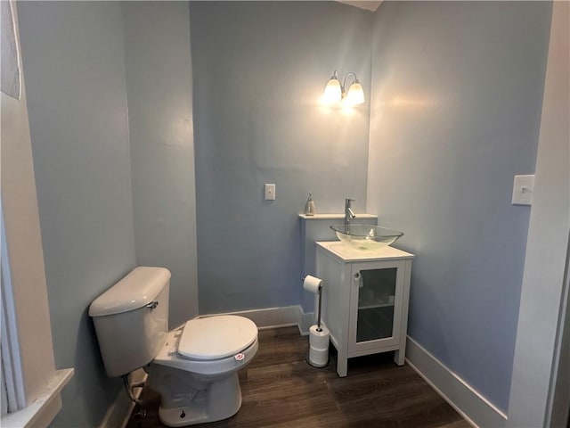 306 Shirls Ave, City Of Washington, PA 15301 - bathroom featuring wood finished floors, toilet, vanity, and baseboards