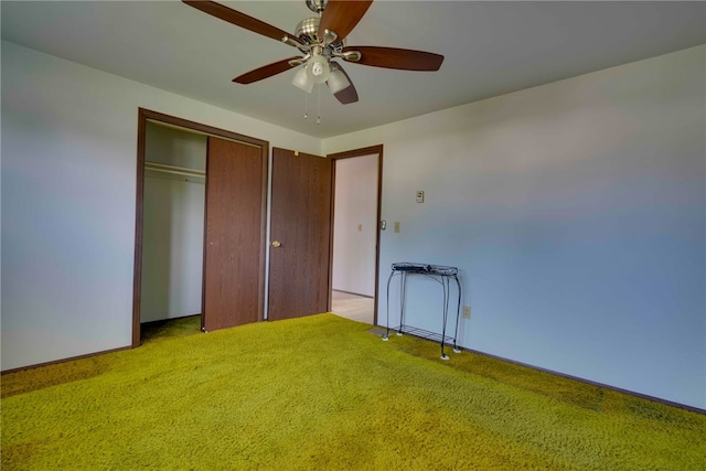 unfurnished bedroom with light colored carpet, a closet, and ceiling fan