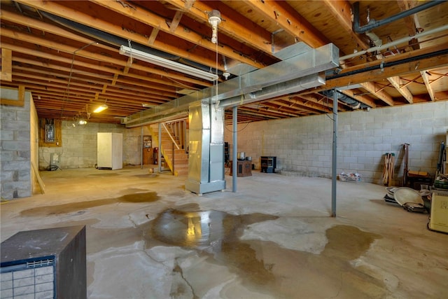 basement featuring heating unit