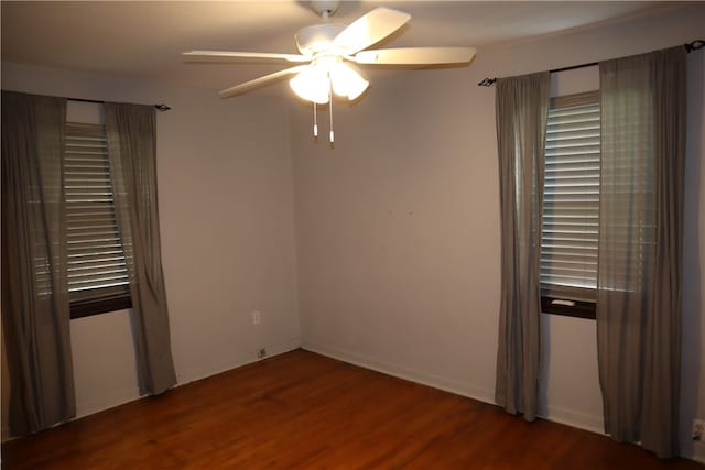 empty room with ceiling fan and hardwood / wood-style floors