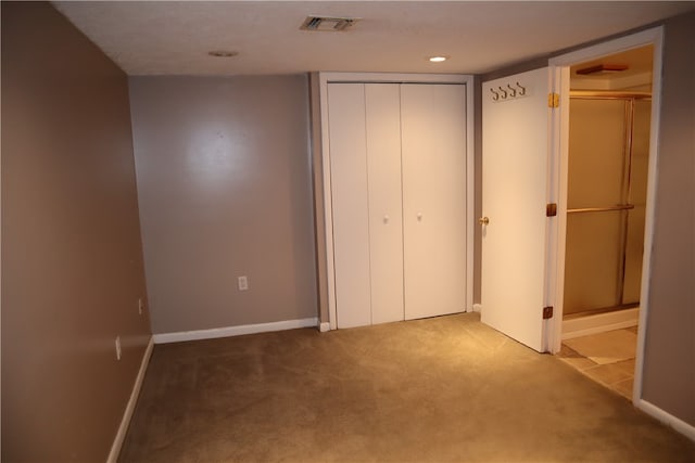 unfurnished bedroom with light carpet