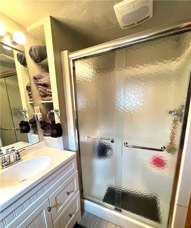 bathroom featuring vanity and walk in shower