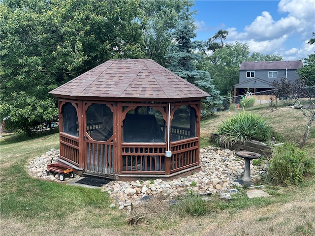 view of outdoor structure with a lawn and a gazebo