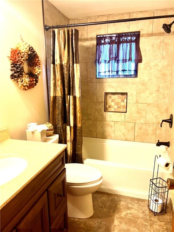 full bathroom featuring vanity, toilet, and shower / bath combination with curtain