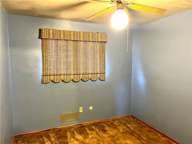 spare room with hardwood / wood-style flooring and ceiling fan