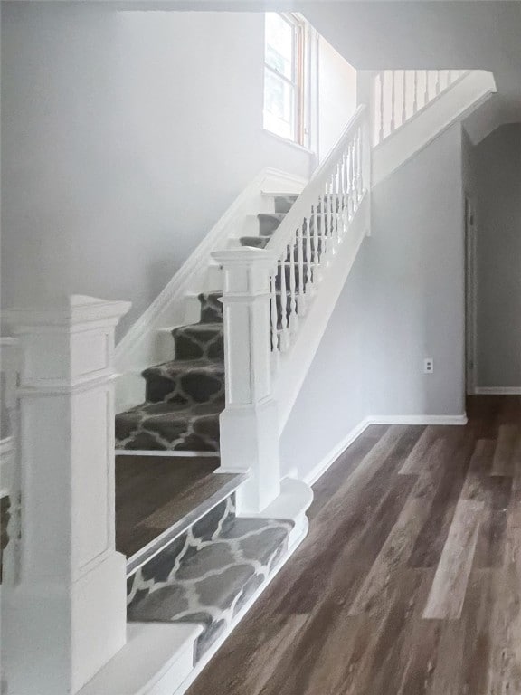 staircase featuring hardwood / wood-style floors