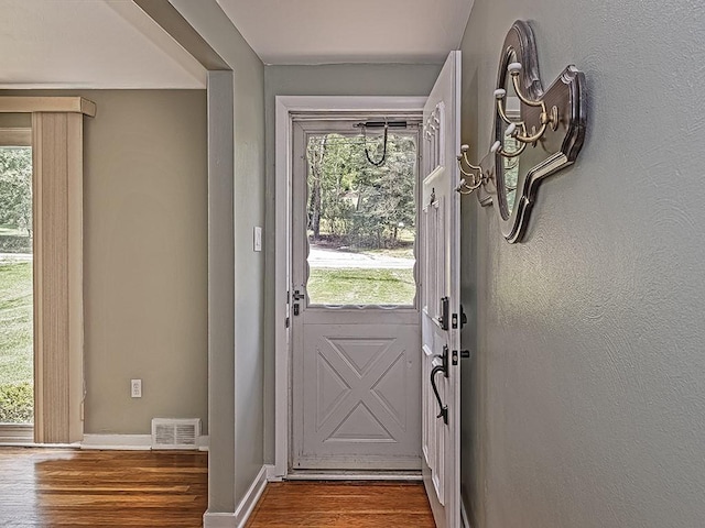 doorway to outside featuring wood-type flooring