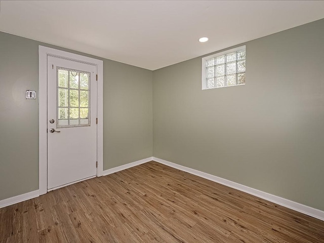 doorway with hardwood / wood-style floors