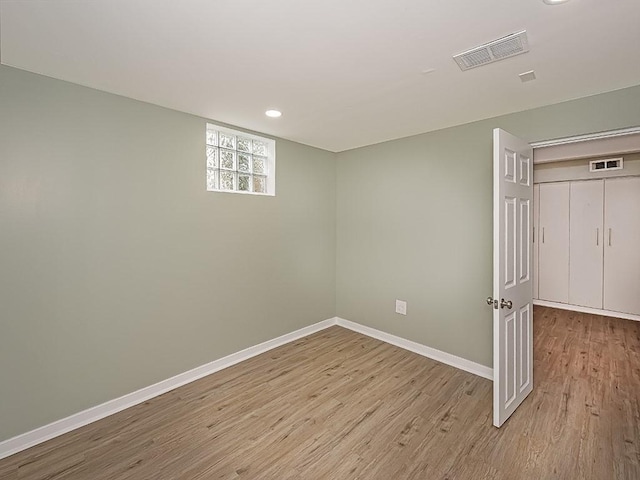 unfurnished room featuring light hardwood / wood-style floors