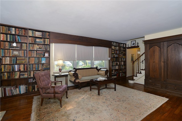 sitting room featuring dark hardwood / wood-style flooring