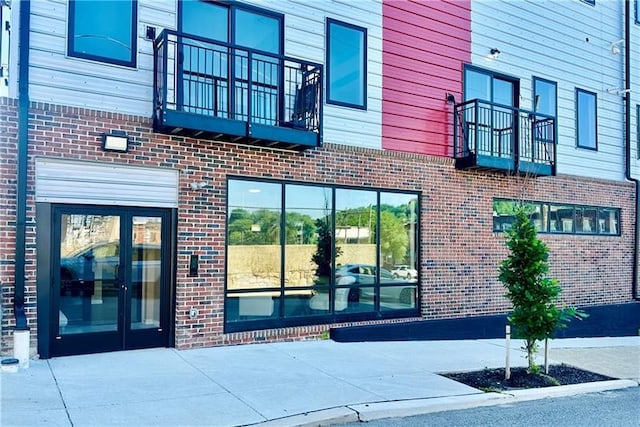 exterior space featuring french doors and a balcony