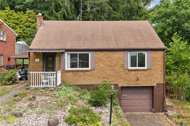 view of front facade featuring a garage and covered porch