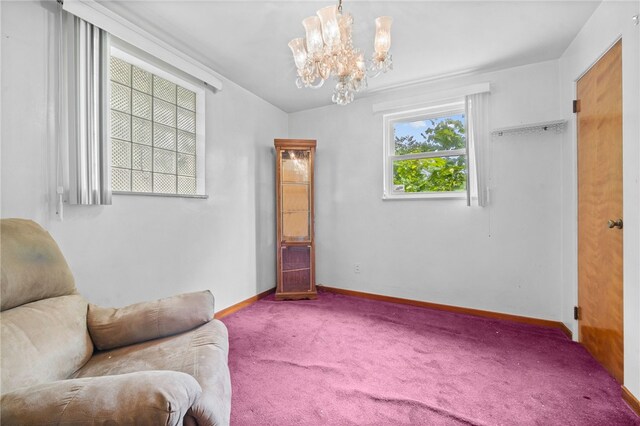 living area with carpet flooring and a chandelier