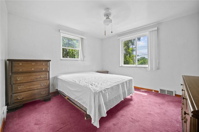 bedroom featuring ceiling fan and carpet flooring