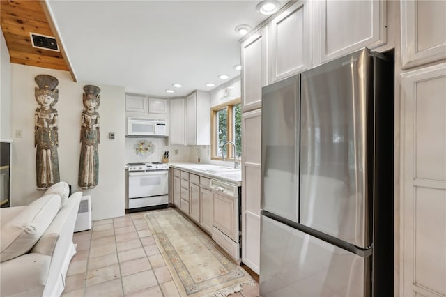 kitchen with wooden ceiling, decorative backsplash, white appliances, sink, and light tile patterned floors