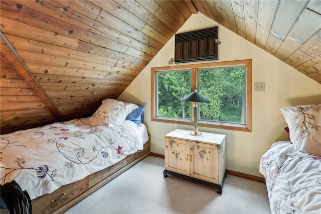 carpeted bedroom featuring lofted ceiling and wood ceiling