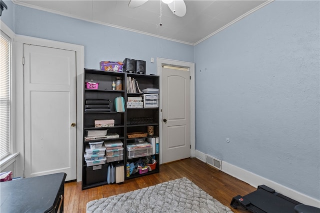 interior space with crown molding, ceiling fan, and wood-type flooring