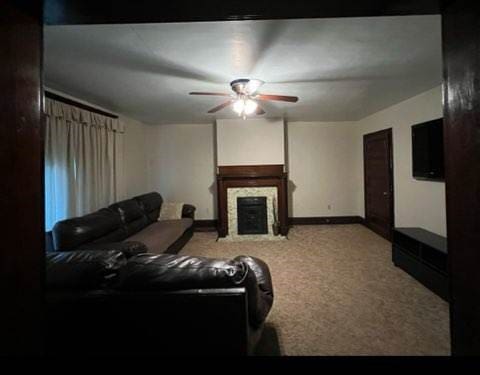 living room with ceiling fan and light carpet