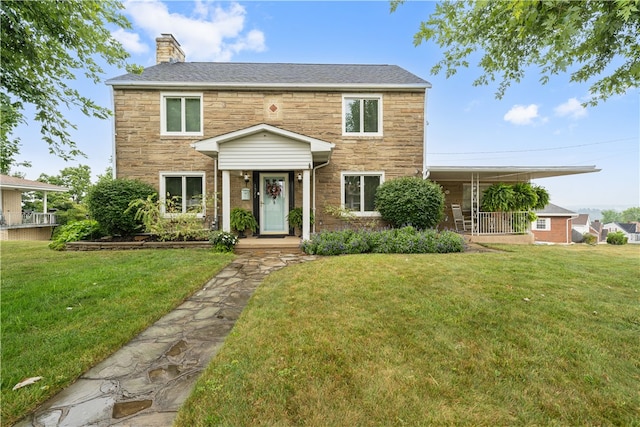 colonial-style house with a front yard