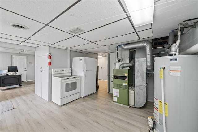 basement featuring white refrigerator, light hardwood / wood-style floors, a paneled ceiling, and water heater