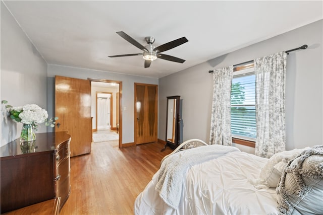 bedroom featuring light wood-type flooring and ceiling fan